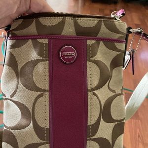 Used but in good condition. Cross body coach with matching wallet.
